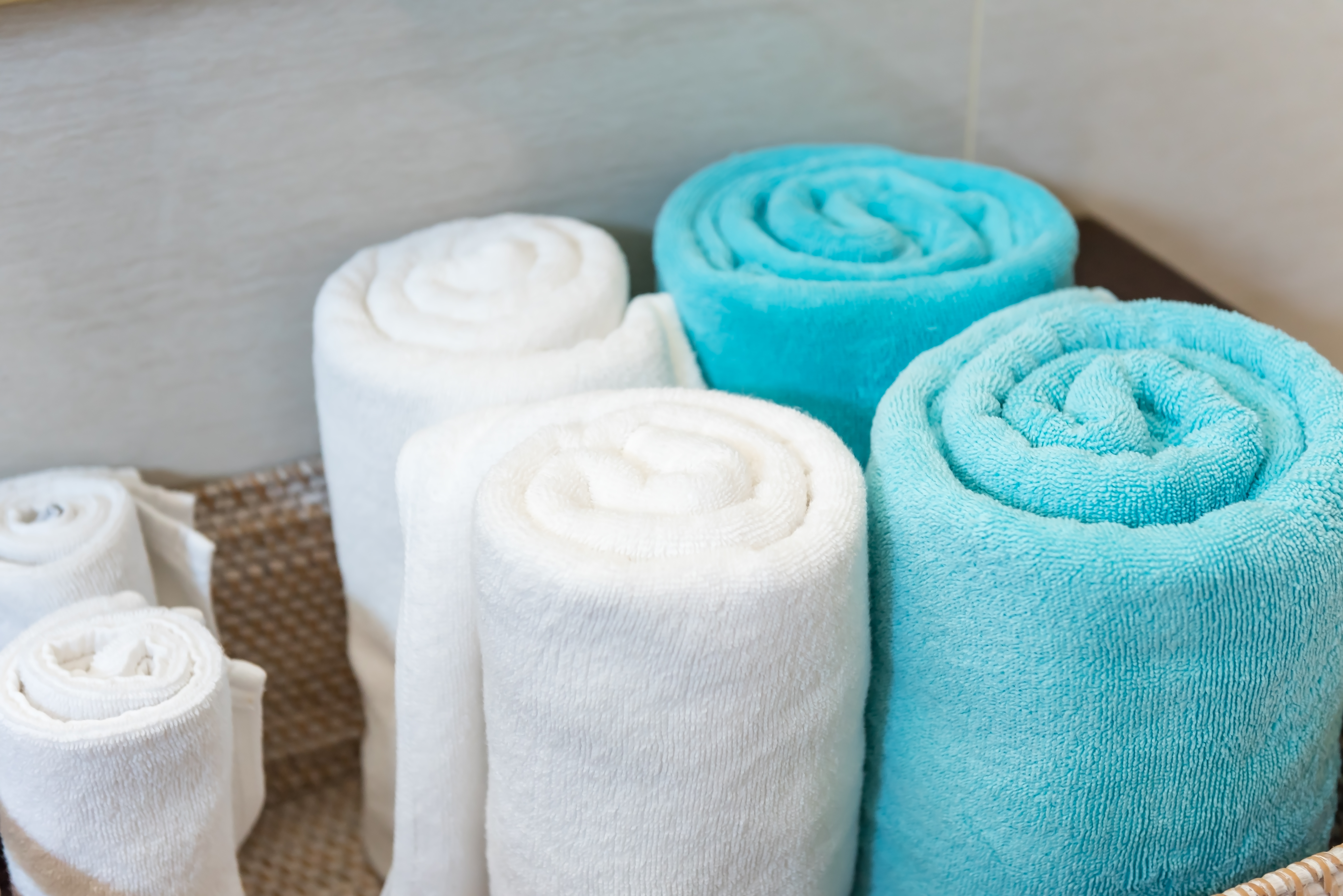 photo of rolled towels in a basket